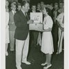 Florida Participation - Aviation Day - Grover Whalen receiving cigars from Miss Tampa