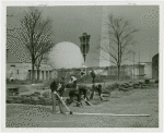 Ford - Workers cutting sod with Trylon and Perisphere in background