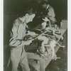 Ford - Exhibits - Cycle of Production - Man using file to finish figure of donkey