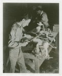 Ford - Exhibits - Cycle of Production - Man using file to finish figure of donkey