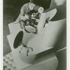 Ford - Exhibits - Cycle of Production - Man painting figure of donkey