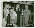 Ford - Exhibits - Edison Institute - Boys demonstrating machines to Thomas Edison Sloane and wife