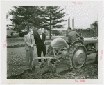 Ford - Ford, Edsel - On Ford tractor with Grover Whalen observing