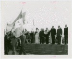 France Participation - Grover Whalen and French officials saluting French flag on Bastille Day