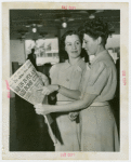 France Participation - Cigarette girls reading newspaper announcing war