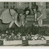 Girl Scouts planting flowers
