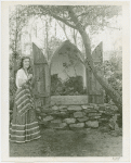 Gardens on Parade - Woman with shrine to flowers