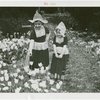 Gardens on Parade - Two Dutch Folk Dancers by tulip bed
