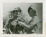 Gardens on Parade - Mother pinning blue ribbon on daughter