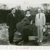 Gardens on Parade - Grover Whalen with man and woman presenting boxwood plant from Mary Washington's garden