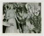 Gardens on Parade - Two women with parasols and baskets surrounded by flowers