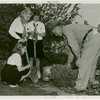 Gardens on Parade - Three Camp Fire Girls learning gardening techniques from head gardener