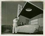 Gas Industries - Man speaking to two women in car