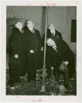 Gas Industries - Grover Whalen and others standing by pipe
