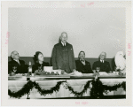 General Cigar Co. Participation - Man giving speech at luncheon with Grover Whalen, a white owl, and others