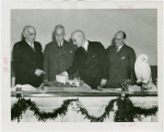 General Cigar Co. Participation - Officials examining model with white owl