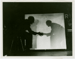 General Electric - Man shaking hands with own shadow at House of Magic