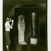 General Electric - Woman pressing button at mummy x-ray exhibit