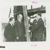 General Electric - Grover Whalen and two others examining pole