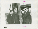 General Electric - Grover Whalen and two others examining pole