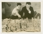 General Motors - Futurama - Norman Bel Geddes with man looking at model