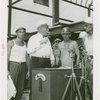 General Motors - Knudsen, William S. - With workers holding rivet above magnetic stove