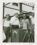 General Motors - Knudsen, William S. - With workers holding rivet above magnetic stove