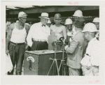 General Motors - Knudsen, William S. - With workers next to magnetic stove