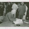 Georgia Participation - Man signing guestbook