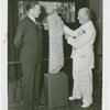 Georgia Participation - Man presenting historic stone slab that lists names of early settlers