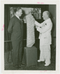 Georgia Participation - Man presenting historic stone slab that lists names of early settlers