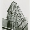 Glass Center - Construction - Man rappelling on tower with bucket