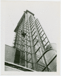 Glass Center - Construction - Man rappelling on tower with bucket