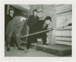 Glass Center - Glassblowing - Grover Whalen and officials lighting furnace