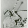Glass Center - Glassblowing - Man with cigar blowing colored glass