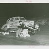 Goodrich Participation - Car going over ramp while Jo-Jo the Clown sits and reads paper