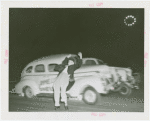 Goodrich Participation - Car racing past Jo-Jo the Clown