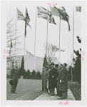 Great Britain Participation - Sir Louis Beale and other men under flags