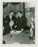 Great Britain Participation - Official signing guestbook while Grover Whalen watches