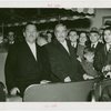 Great Britain Participation - Grover Whalen and other official in cart surrounded by others