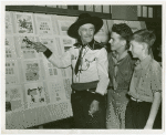 Great Britain Participation - Stamp Exhibit - Charles 'Broncho' Miller shows two boys the Pony Express stamp