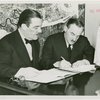 Greece Participation - Grover Whalen signing contract with Nicholas Tserepis (Consul General)
