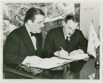 Greece Participation - Grover Whalen signing contract with Nicholas Tserepis (Consul General)