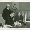 Greece Participation - Grover Whalen signing contract with Nicholas Tserepis (Consul General) and others