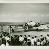 Howard Hughes' airplane with onlookers