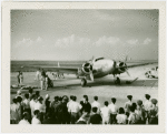 Howard Hughes' airplane with onlookers