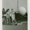 Nels Holmes and guide with scooter and monkey
