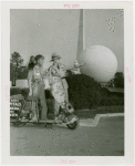 Nels Holmes and guide with scooter and monkey