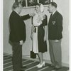 Lois Hering (Miss New York Foreign Trade Week) with men