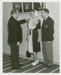 Lois Hering (Miss New York Foreign Trade Week) with men